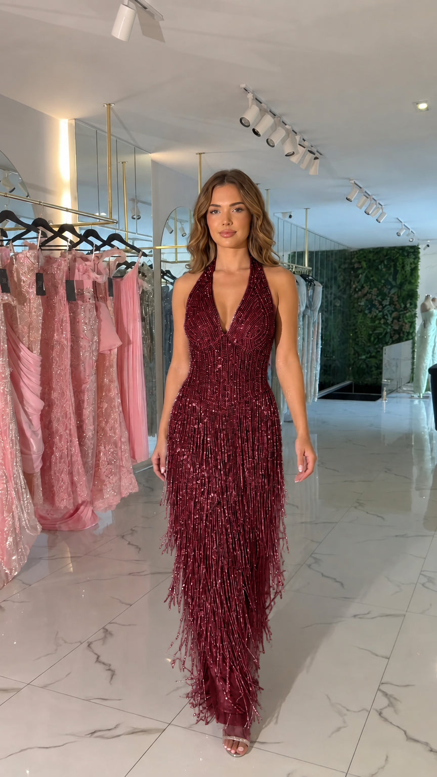 Front view of burgundy red halter beaded fringe evening maxi dress