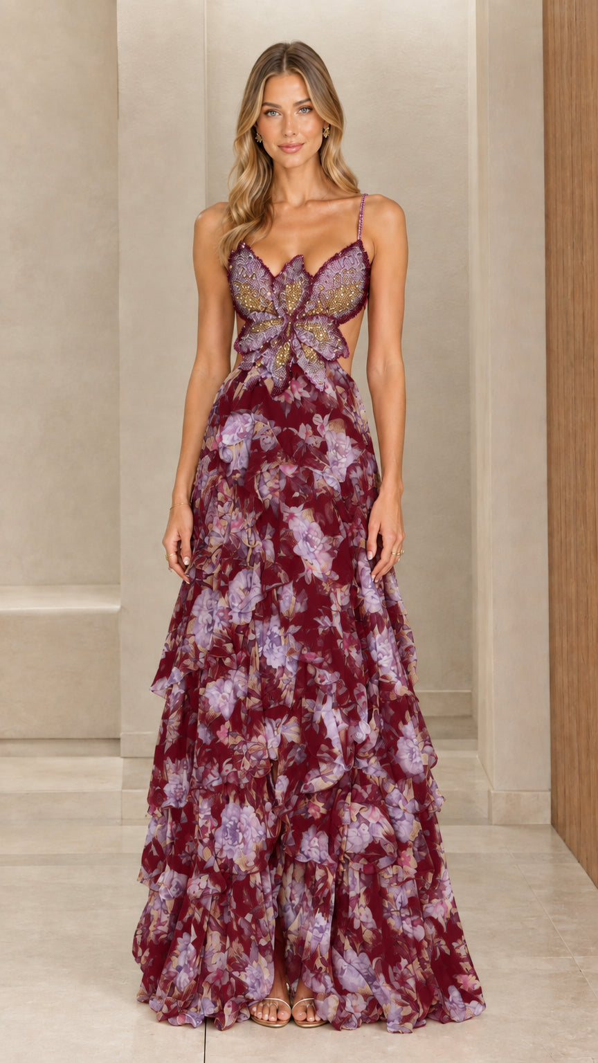 Model wearing burgundy floral tiered maxi dress with beaded butterfly front