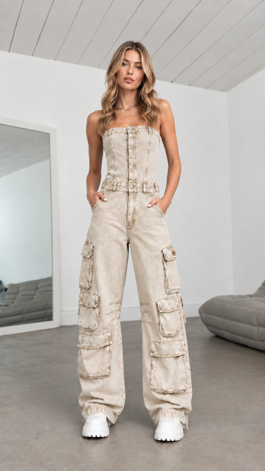 Model wearing Beige sand strapless denim cargo wide leg jumpsuit