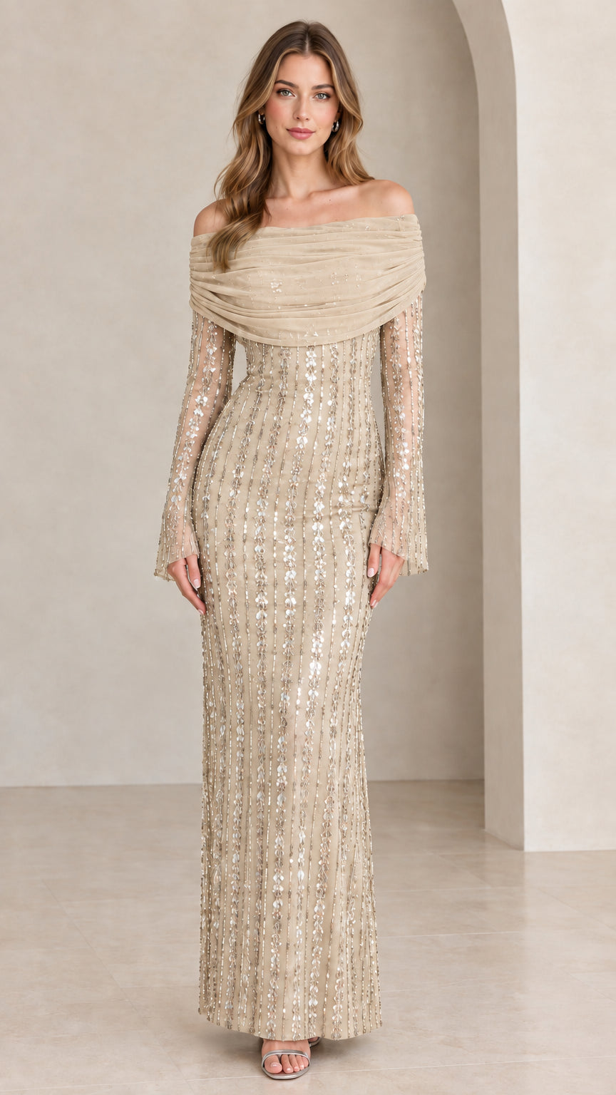 Front view of model wearing Champagne gold off-the-shoulder sequin evening gown