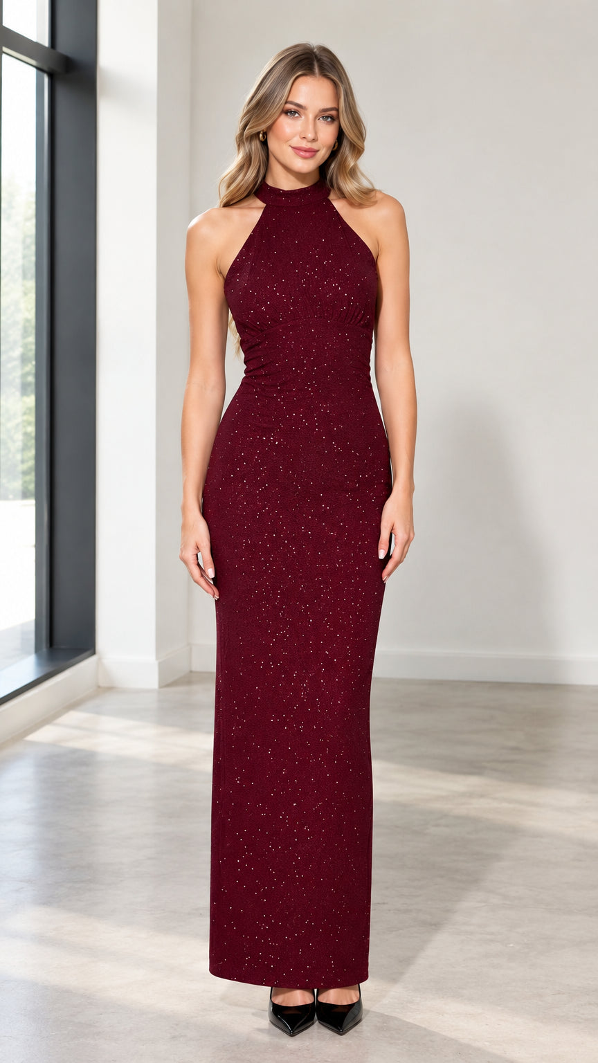 Front view of woman wearing burgundy shimmer halter neck maxi evening gown