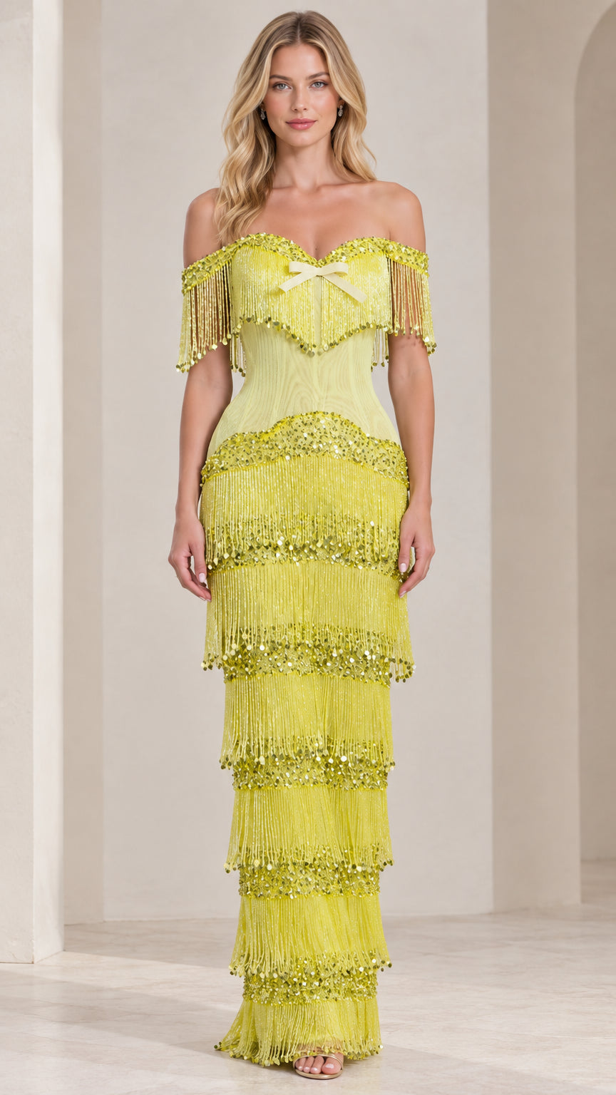 Front view of model wearing lime green off-shoulder tiered fringe sequin maxi dress