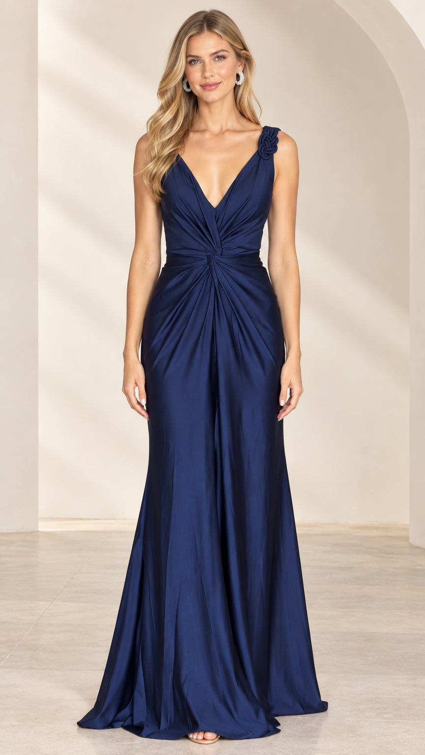 Front view of model wearing Navy Blue V-neck ruched satin evening gown with shoulder rosette