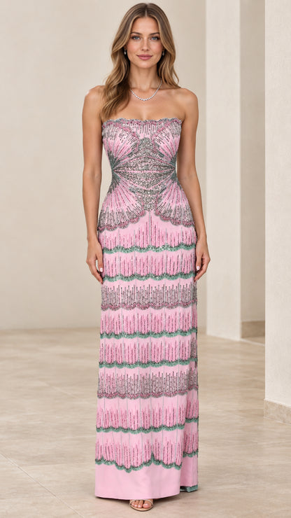 Front full view of woman wearing pink strapless beaded column evening gown