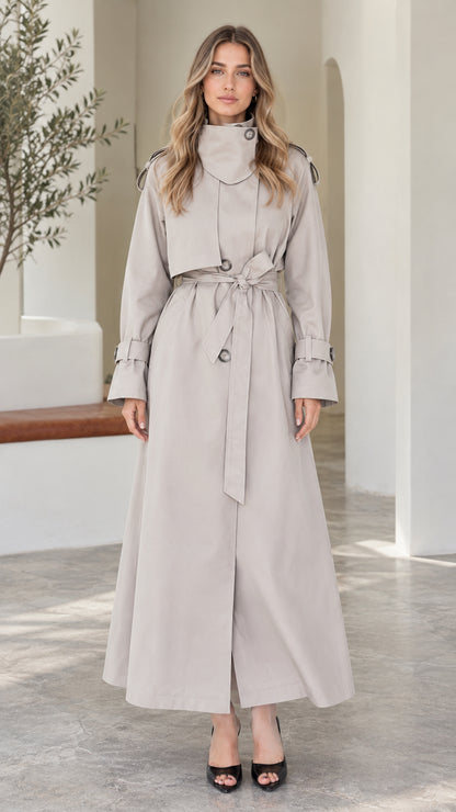 Front view of model wearing Light Grey full-length high-neck belted maxi trench coat