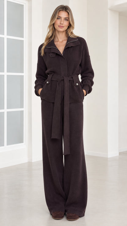 Front view of woman wearing dark brown ribbed knit belted jacket and wide-leg pants set