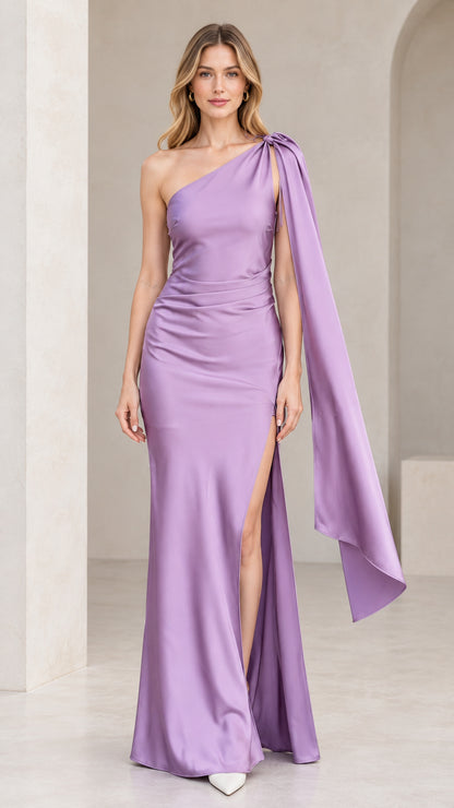 Front full view of lavender one-shoulder satin maxi gown with draped shoulder sash and side slit