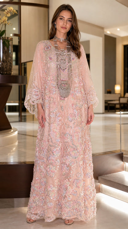Front full view of woman wearing blush pink floral sequin embroidered kaftan dress
