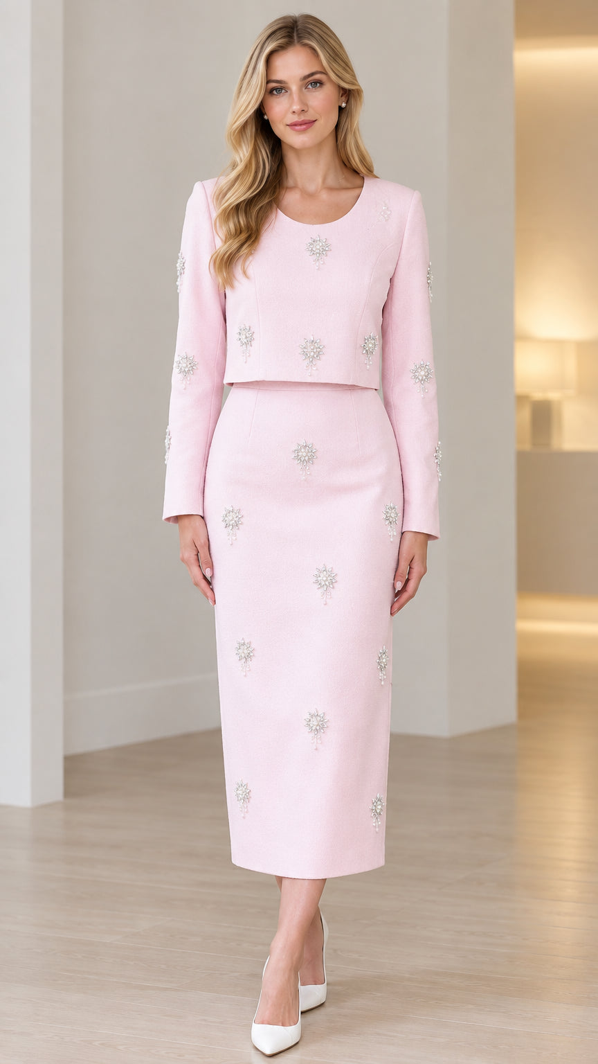 Front full view of light pink two-piece embellished midi dress set with long sleeves
