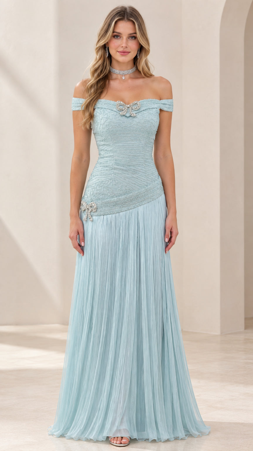 Front view of woman wearing ice blue off-the-shoulder pleated evening gown with beaded bow accents