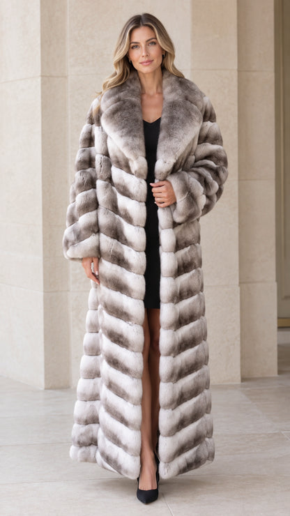 Front view of woman wearing full-length grey ombre chevron faux fur maxi coat
