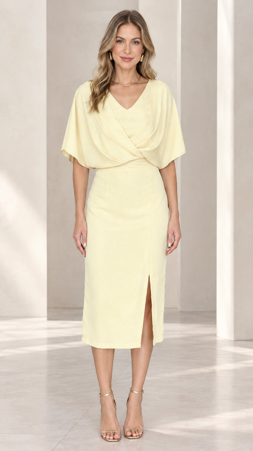 Front view of model wearing pale yellow draped flutter sleeve midi dress