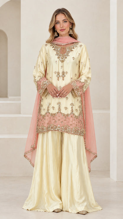 Front full view of women's cream and blush embroidered sharara suit set
