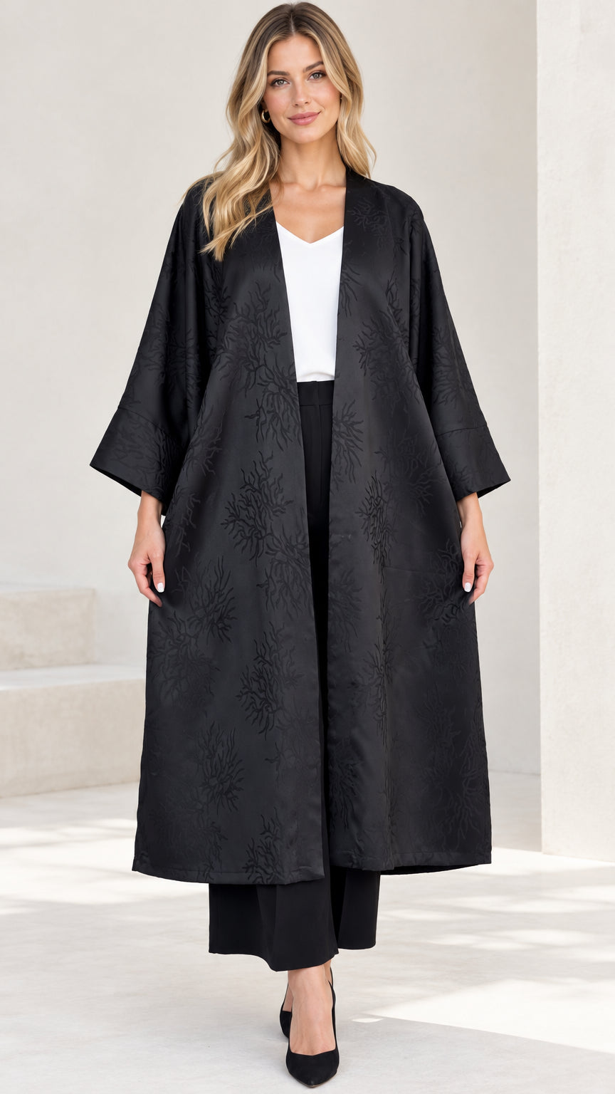 Full front view of women's black jacquard open-front duster coat with wide sleeves