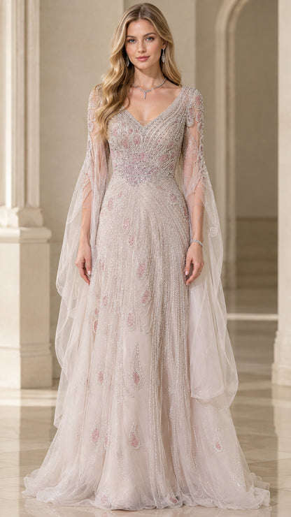 Front view of woman wearing champagne beaded V-neck evening gown with flowing cape sleeves