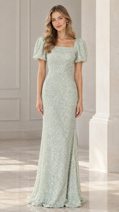 Front view of model wearing floor-length sage green sequin evening gown with puff sleeves and square neckline