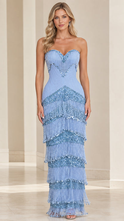 Front view of woman wearing sky blue strapless sweetheart beaded tiered fringe maxi dress