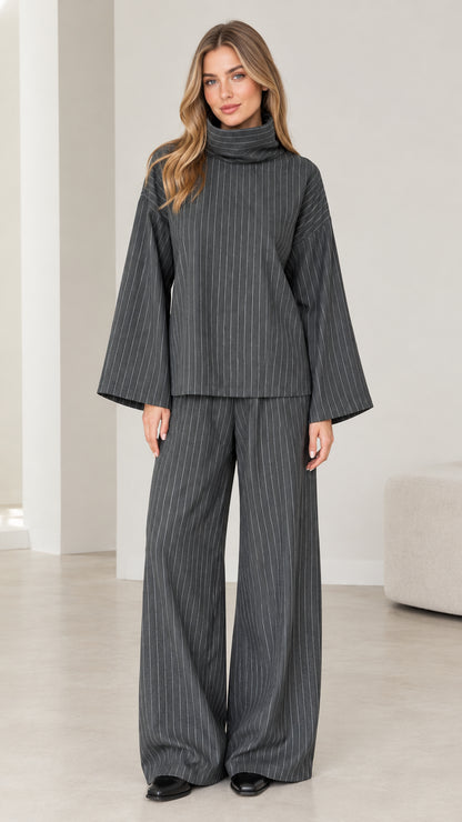 Front view of woman wearing Charcoal Grey pinstripe turtleneck top and wide-leg pants set