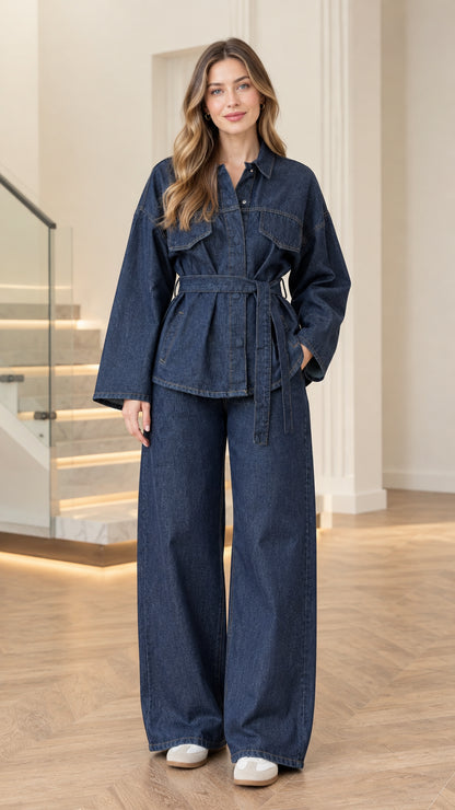 Full front view of model wearing dark blue denim belted jacket and wide-leg pant set