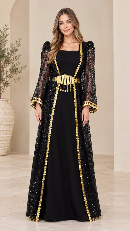Front full view of black sequin overlay kaftan maxi dress with gold coin trim and belt