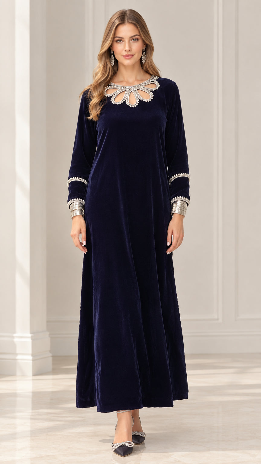 Front view of model wearing Navy Blue long sleeve velvet maxi dress with crystal cutout neckline