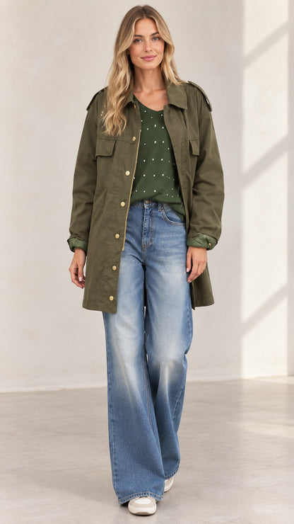 Front full view of women's army green utility jacket paired with wide-leg jeans