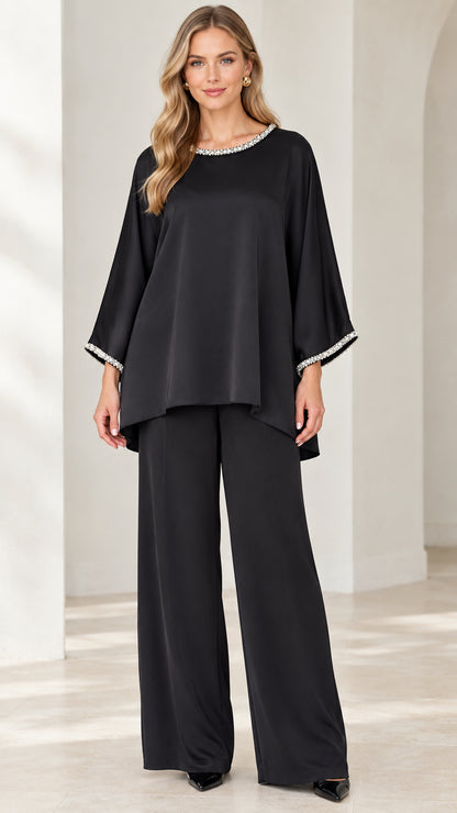 Front view of woman wearing Black embellished tunic top and wide-leg pant set