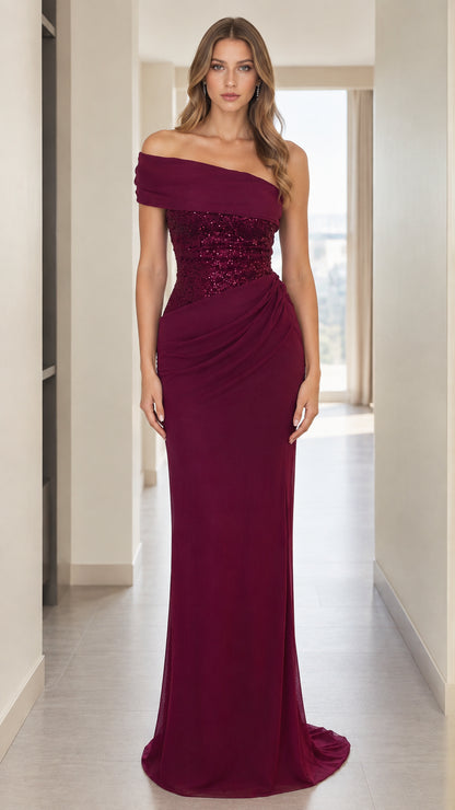 Front view of woman wearing burgundy sequined off-the-shoulder maxi gown