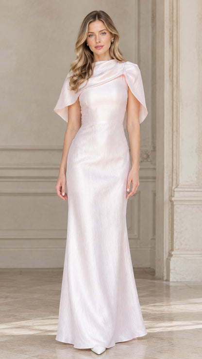 Front view of woman wearing blush pink draped cowl capelet maxi evening gown