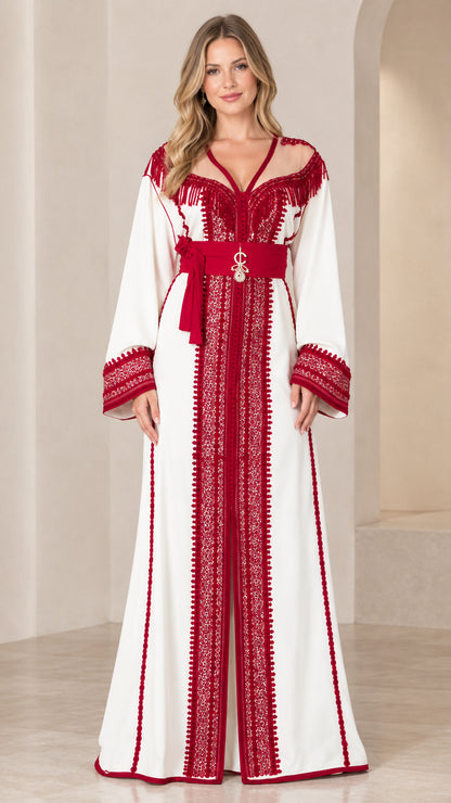Front view of model wearing white Moroccan caftan dress with red embroidery and matching jeweled belt