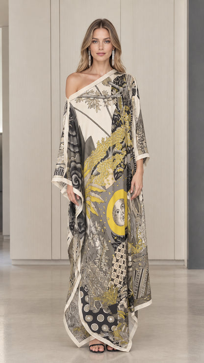 Front view of model wearing ivory one-shoulder celestial print kaftan maxi dress