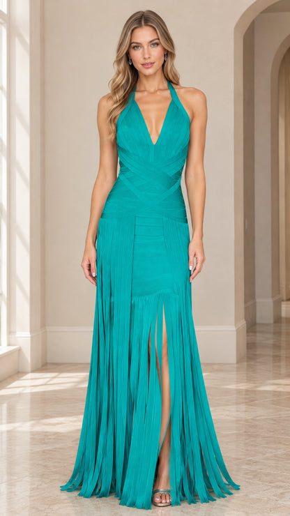 Front full view of woman wearing teal halter neck bandage fringe maxi dress with front slit