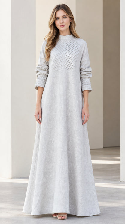 Front full view of light grey mock neck maxi dress with chevron pleated bodice