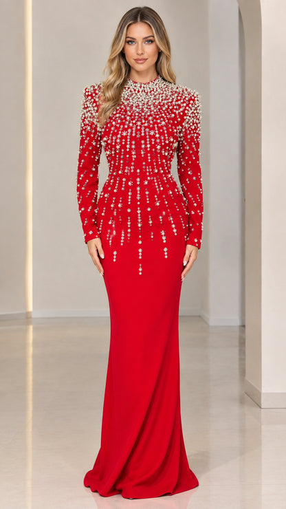 Front view of model wearing a vibrant red pearl-embellished long sleeve mermaid evening gown