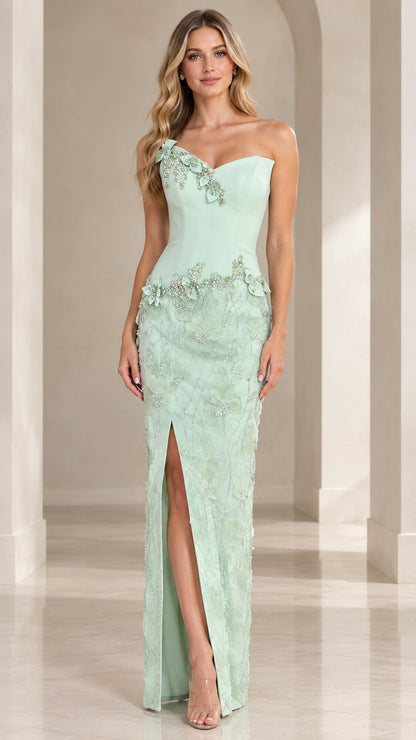 Front view of mint green one-shoulder evening dress with floral appliqué and slit