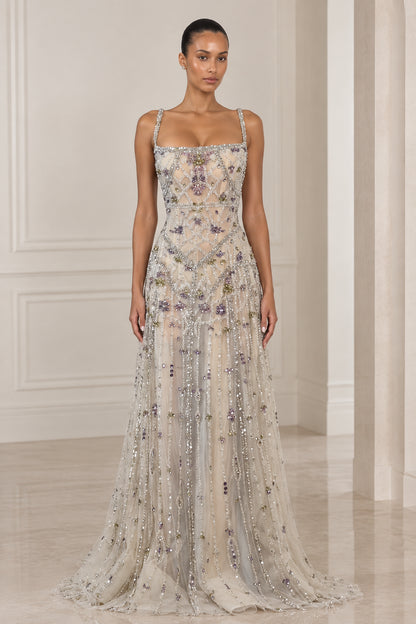 Front view of model wearing Silver Champagne square neck beaded floor-length evening gown