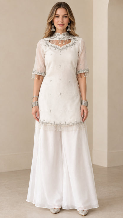 Front full view of white embroidered kurti sharara suit set with beaded fringe