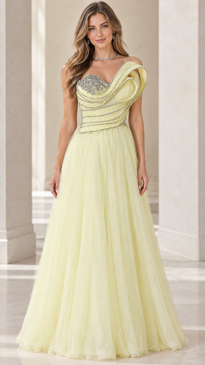 Front view of model wearing pastel yellow asymmetric rhinestone tulle evening gown