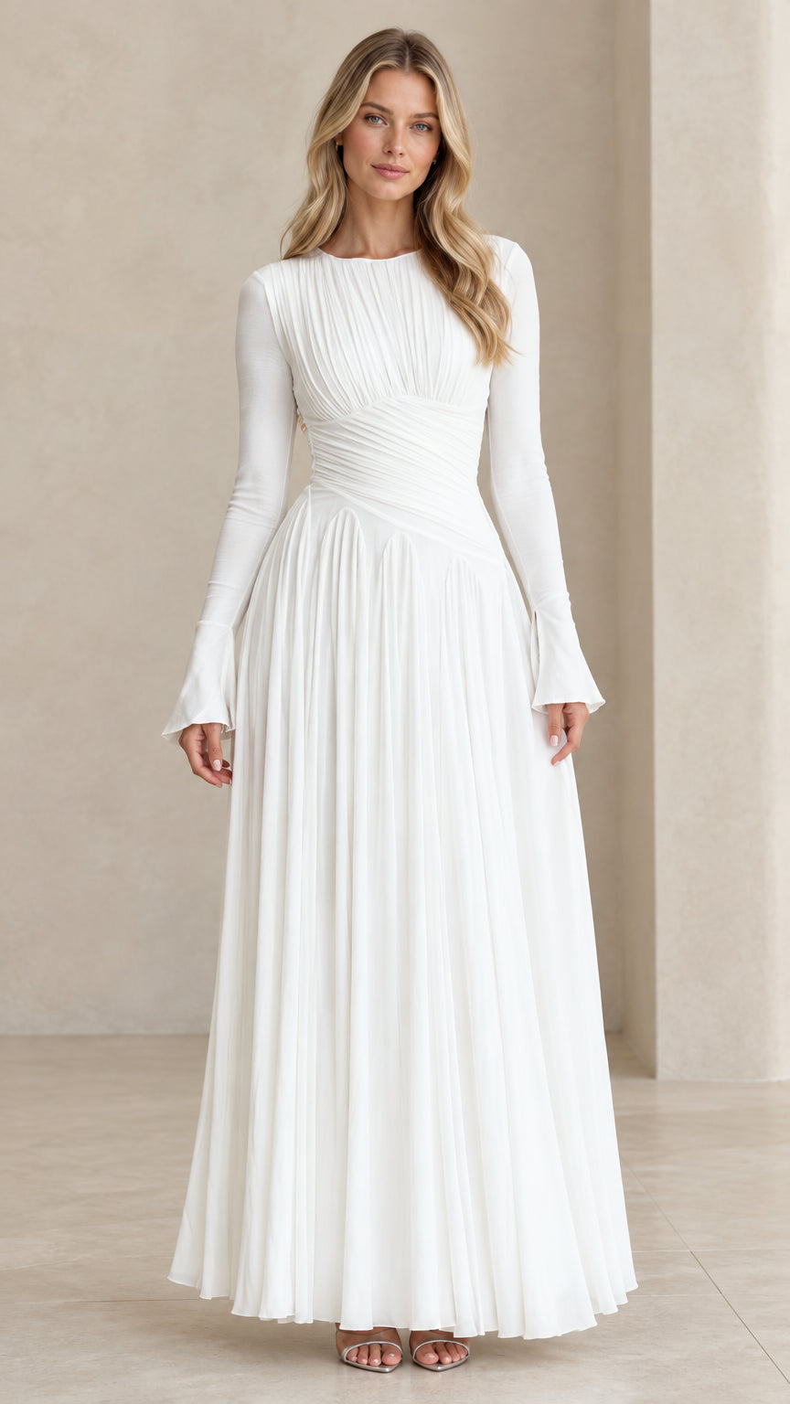 Full front view of model wearing white pleated long sleeve maxi evening dress