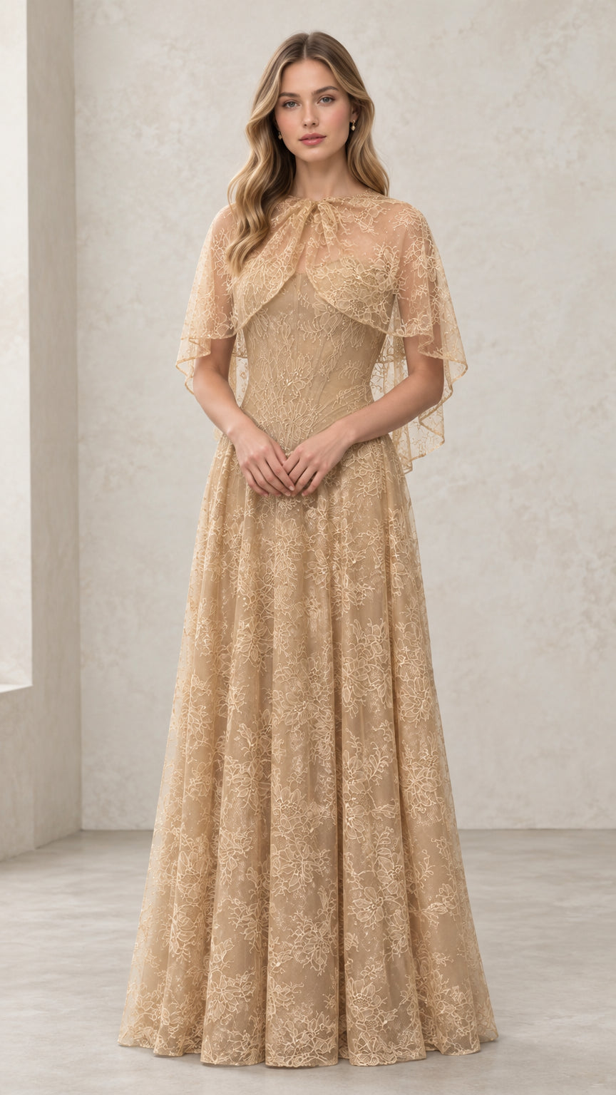 Front view of woman wearing Champagne embroidered lace capelet evening gown