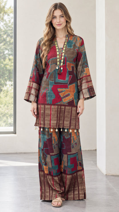 Front view of model wearing burgundy abstract print tunic and matching wide-leg pants
