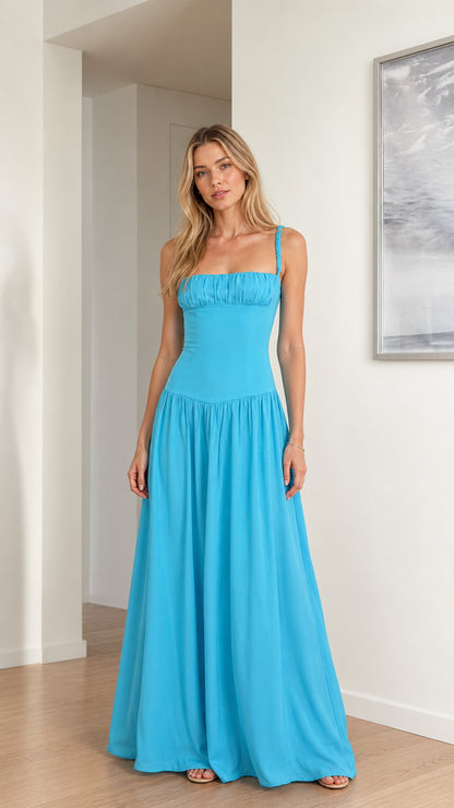 Front view of model wearing sky blue ruched bust drop waist maxi dress