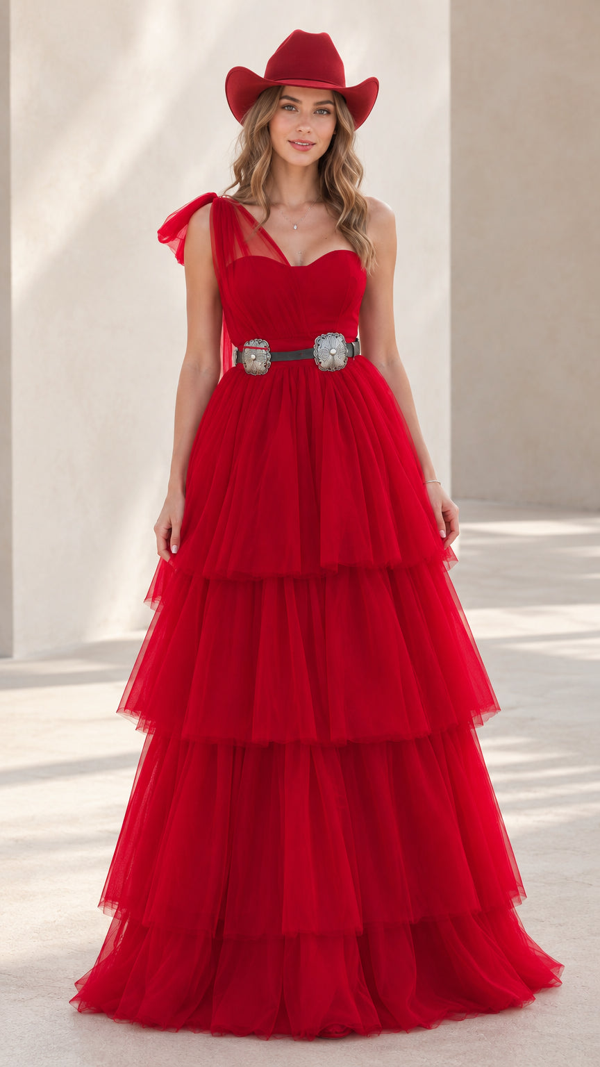 Front view of model wearing red one-shoulder tiered tulle maxi gown with western hat