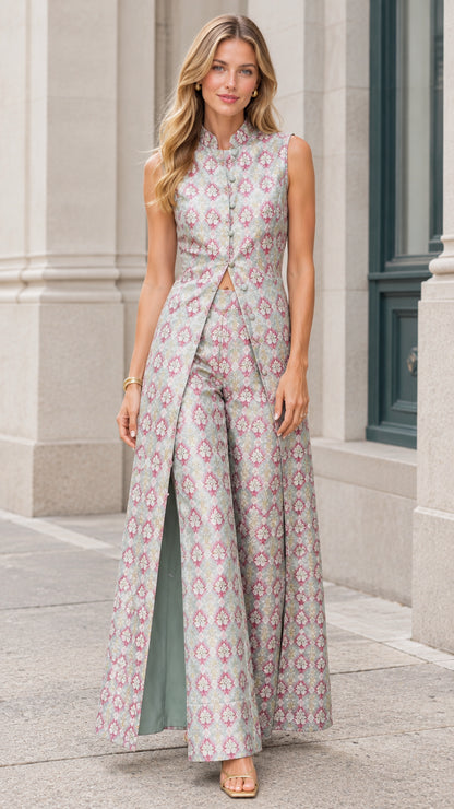 Front view of model wearing Sage Green sleeveless jacquard maxi jumpsuit with front slit and wide-leg pants