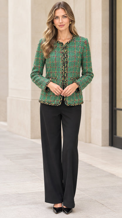 Full front view of a woman wearing a green plaid tweed jacket with black trousers