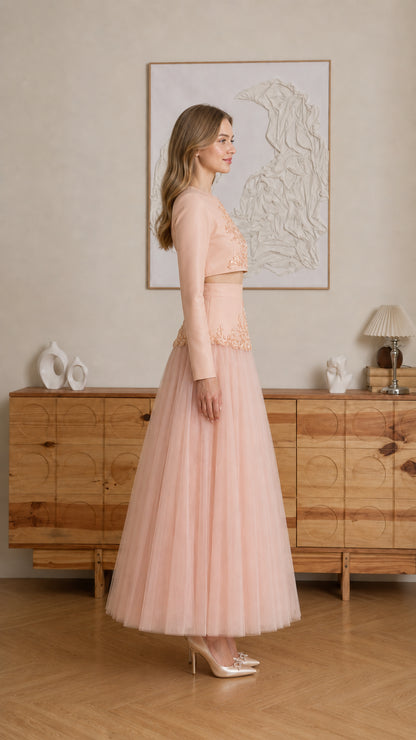 Model wearing Blush Pink two-piece evening set - side profile view