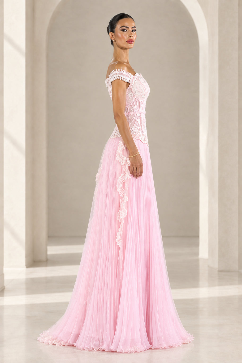 Side profile of Blush Pink embroidered corset evening maxi dress