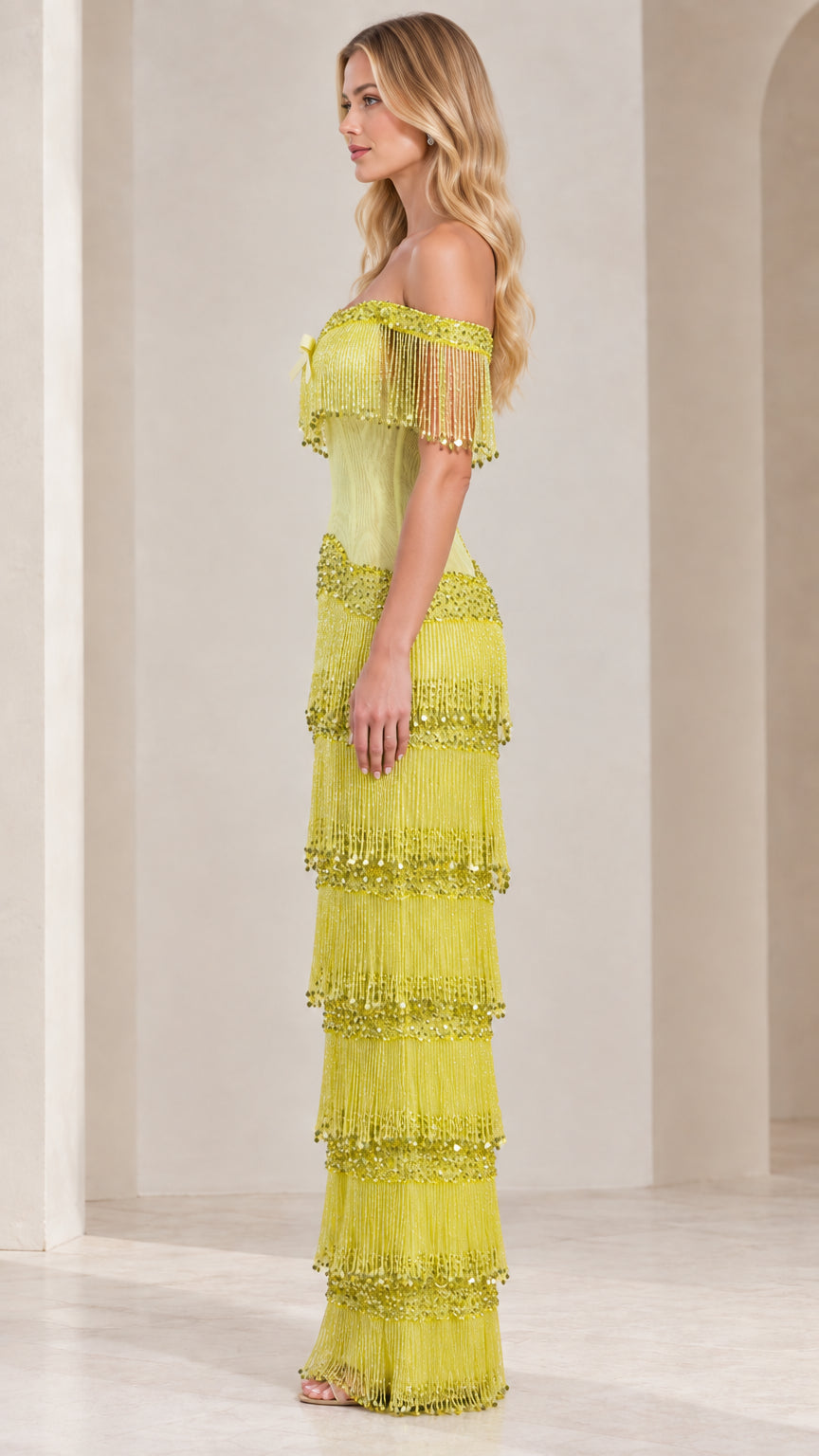 Side profile view of lime green fringe maxi gown