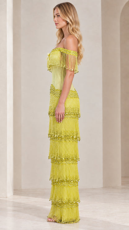 Side profile view of lime green fringe maxi gown