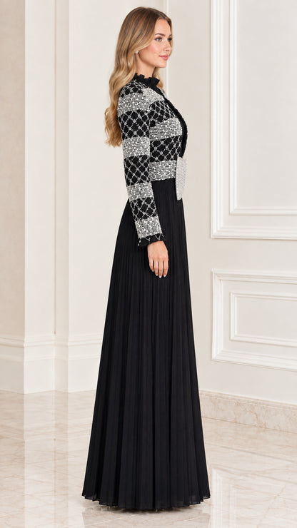 Side profile of black long sleeve pleated formal gown